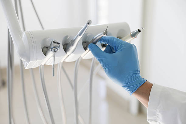 Professional Tooth Extraction technician working in Columbia, MS